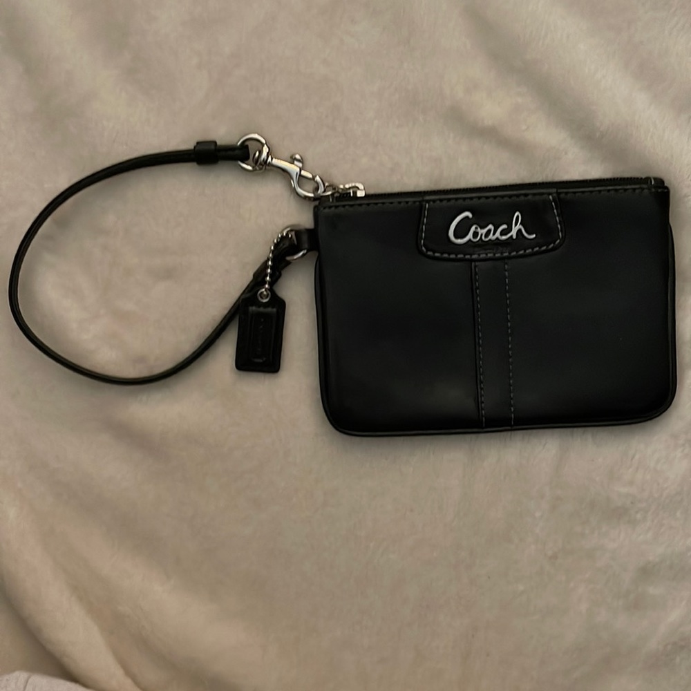 Gently used Coach black leather wristlet with zipper closure